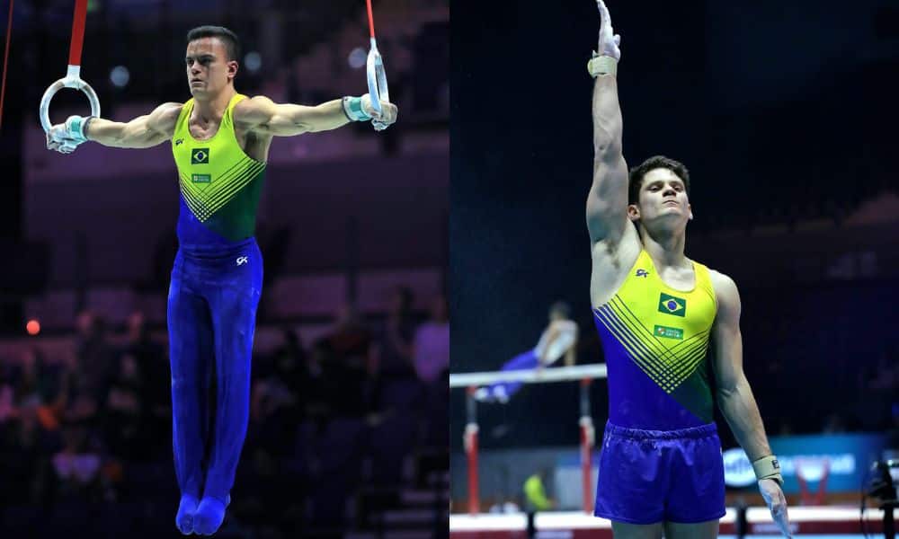 Mundial de ginástica: Caio fazendo argolas, enquanto Diogo ergue um braço saudando os juízes