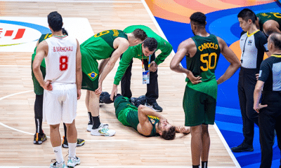Raulzinho cai na quadra após lesão na Copa do Mundo de basquete masculino
