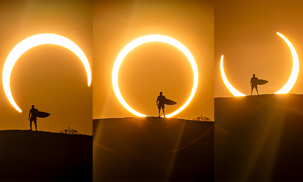 Na imagem, Ítalo Ferreira com sua prancha diante do eclipse solar.
