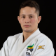 Matheus Takaki olha para foto; o judoca foi suspenso por doping e está fora de Paris