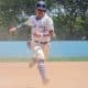 Na imagem, jogador do Nippon Blue Jays correndo da terceira base para fechar o ponto.